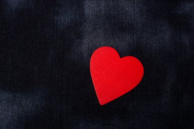Red heart shaped on black color for love card and valentine day concept clipart