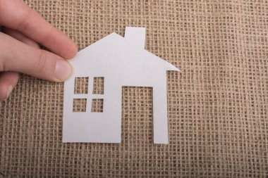 Littlepaper modeli ev kahverengi bir arka plan üzerine yerleştirilen