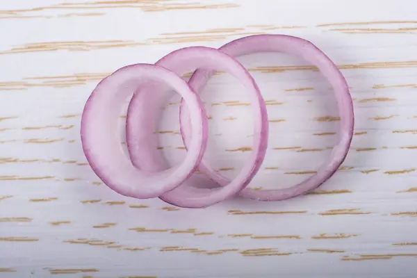 Stock image Sliced onion rings and  onion slices  on the background