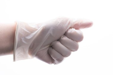 Koruyucu steril lateks eldiven. Elindeki eldiven. Coronavirus COVID-19 salgın konsepti
