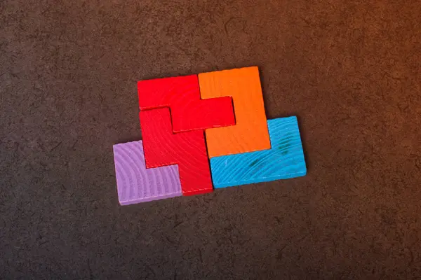 Stock image Piece of wooden colorful  puzzle as problem solving concept