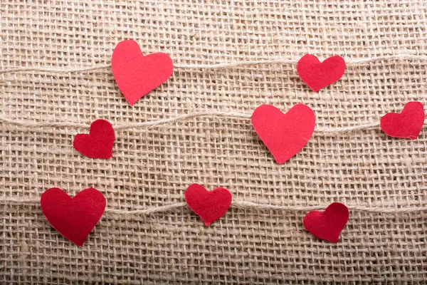 stock image Love concept with heart shaped papers on linen threads