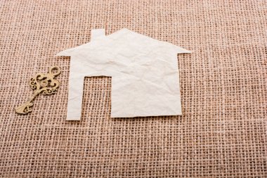 Bir tuval arka plan üzerinde ev şekil yanında Retro anahtar