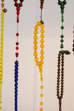 Set of praying beads of various colors clipart