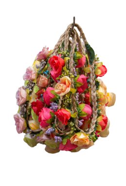 There are fake textile flowers on the crown. Colorful isolated crowns for sale made of fake flowers