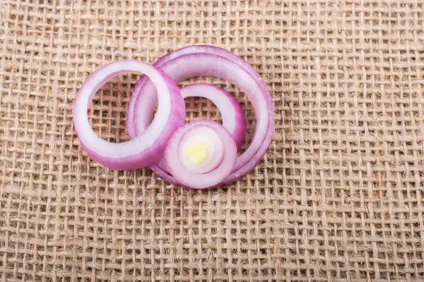 stock image Sliced onion rings and  onion slices  on the background