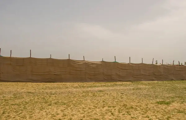 stock image Linen canvas fabric texture used as a wall outdoors