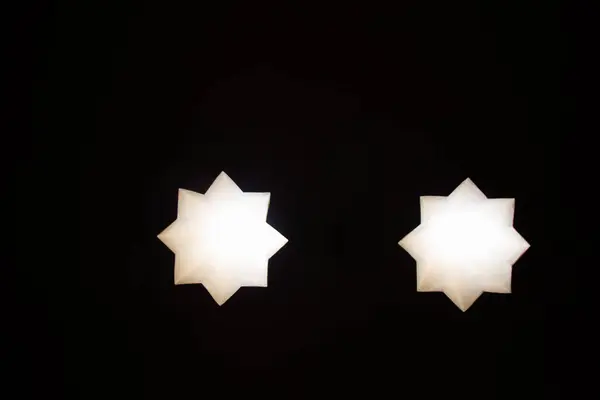 stock image 8 pointed star holes through a wall in the view