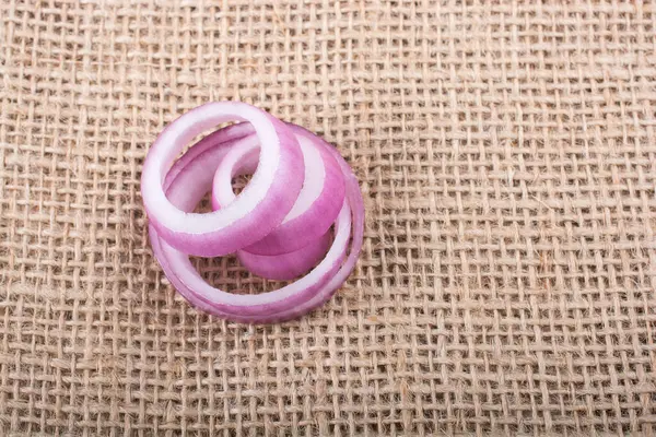 stock image Sliced onion rings and  onion slices  on the background