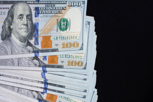 Hand holding American dollar  banknotes isolated on white background