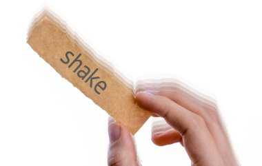 hand holding a piece of notepaper with shake wording clipart