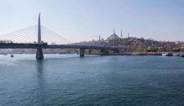 Halic metro bridge in Golden Horn in the view clipart