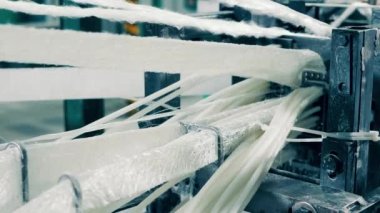 Fiberglass is getting manufactured by an industrial machine. 4K