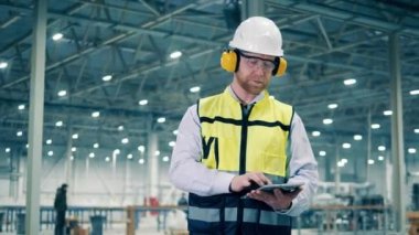 Factory engineer is giving directions at the workplace. 4K