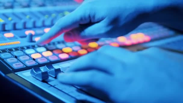 Sound Producer Manually Regulating Mixing Console — Stock Video