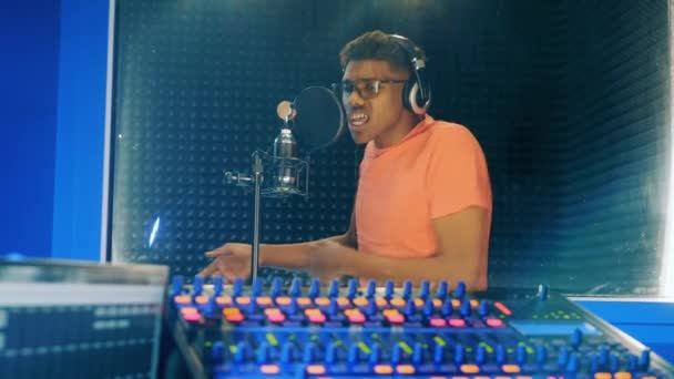 Young African Man Singing Recording Studio Booth — Stockvideo