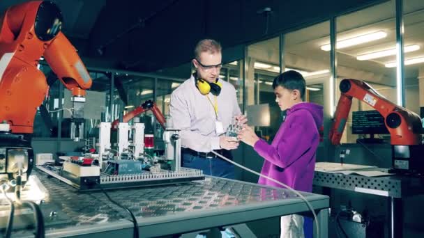 Boy Studying Robotic Hand Tutor Helping Him — Stok video
