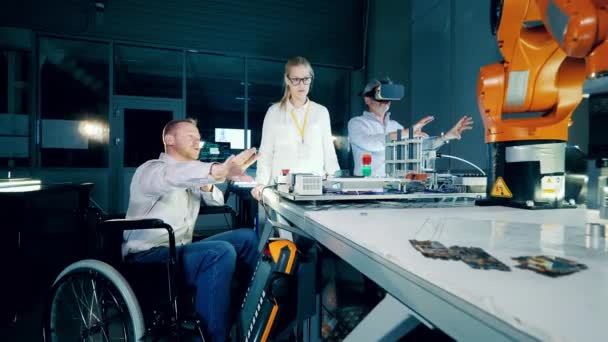 Disabled Engineer His Colleagues Using Work Robots — Vídeo de Stock