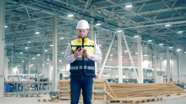 Factory employee answers the phonecall. 4K