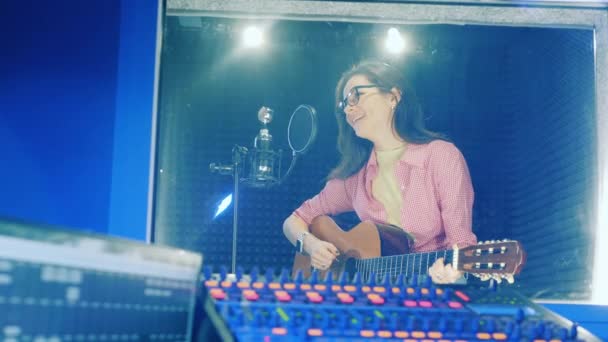 Female Musician Getting Recorded While Playing Guitar — Stock video