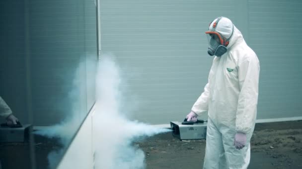 Sanitary Worker Fumigating Bus Exterior — Stock Video
