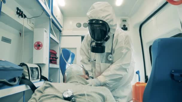 Doctor Hazmat Suit Checking Patients Breath — Stock Video