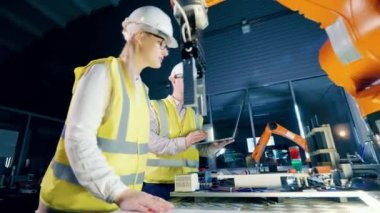 Factory engineer engaged in a virtual reality while working. 4K