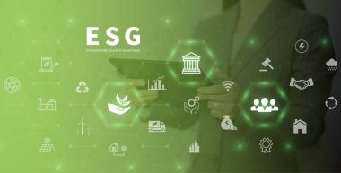 ESG environment social governance investment business concept. Women use a computer to analyze ESG, surrounded by ESG icons .close to the computer screen in business investment strategy concept.
