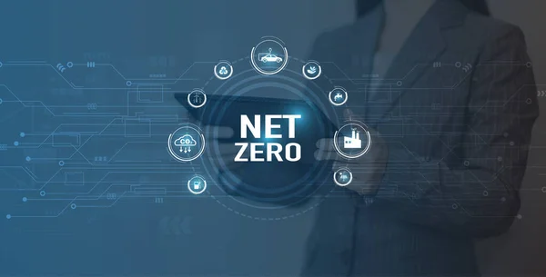 Net Zero Eco business concept. Women use a computer to analyze Net Zero, surrounded by Net Zero icons .close to the computer screen in business investment strategy concept.