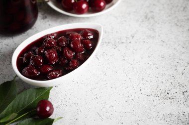 cherry jam and fresh cherries in a bowl, homemade preserves