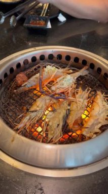 Grilled shirmp. Eating Buffet food in a Japanese restaurant. Meat lover buffet.