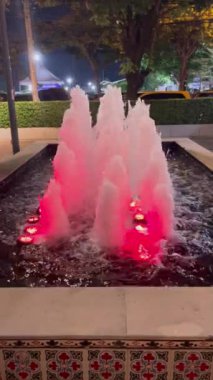 Bangkok, Thailand. - December 30, 2022: Small fountain at Asiatique The Riverfront in the evening. Fountain front view.