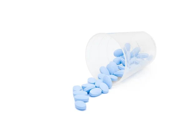 Blauwe Pillen Gemorst Uit Medicijnbeker — Stockfoto