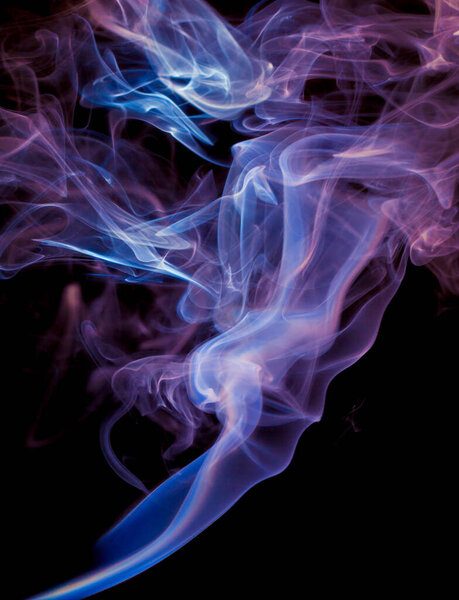 Vibrant color incense smoke on black