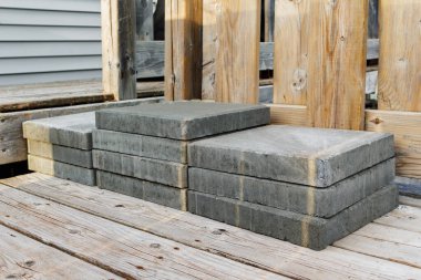 Cement construction blocks on house deck
