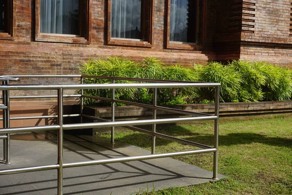 stock image Parapet with handrails for disabled persons in wheelchairs and their companions