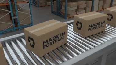 Cardboard boxes with Made in Portugal on conveyor belt line isolated on warehouse background