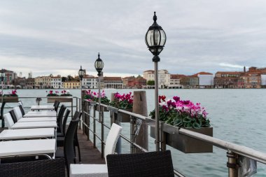 Detail of a restaurant by the water in Venice, Italy