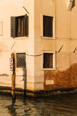 Architectural detail of a building by a canal in Venice, Italy
