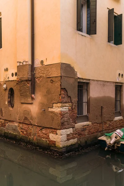 Architectural detail of a building by a canal in Venice, Italy