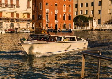Taxi boat navigating in the canals of Venice, Italy