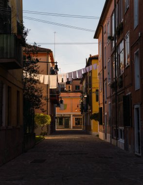 Charming street in Venice, Italy with clothes hung to dry