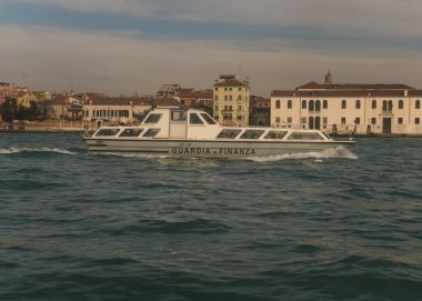 Government boat navigating on the lagoon in Venice, Italy