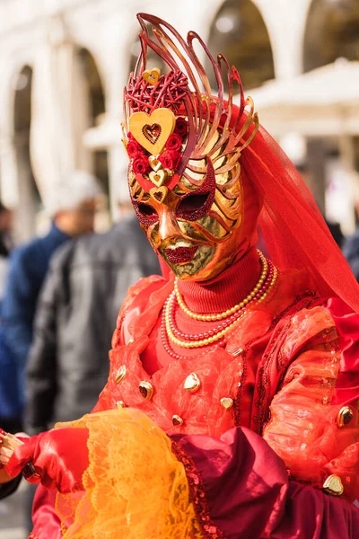 People wearing colorful and elaborate masks during the Venice carnival in Venice, Italy