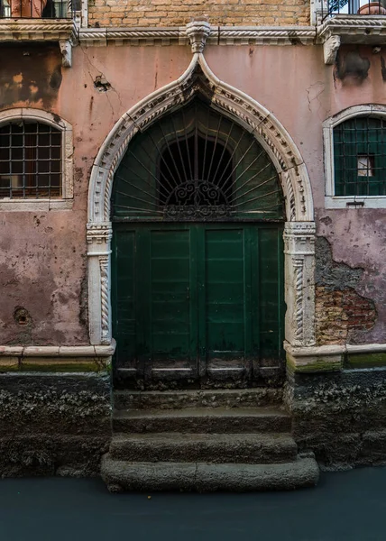 Canal in Venice showing extremely low tide levels. 