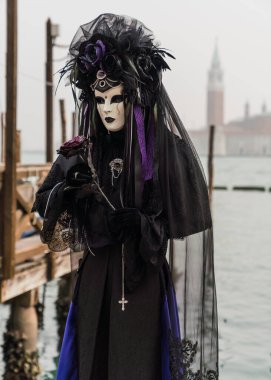 People wearing costumes during the Venice carnival in Italy 