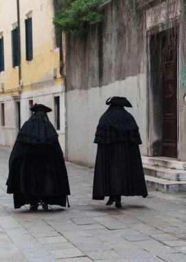 People wearing costumes during the Venice carnival in Italy 
