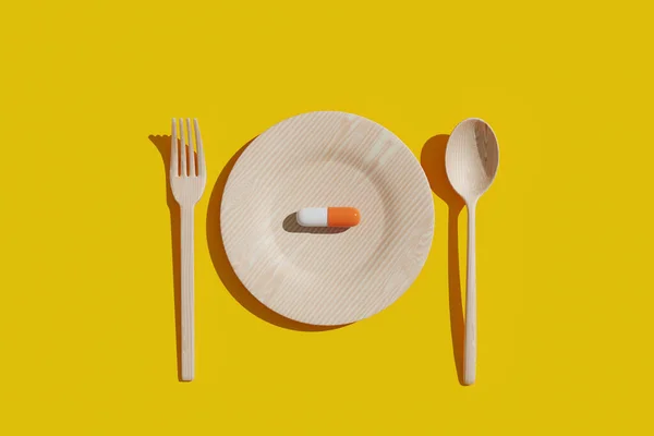 Una Pillola Nutrizionale Viene Posta Piatto Con Una Forchetta Cucchiaio — Foto Stock