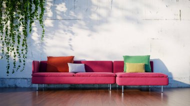 3 koltuklu kırmızı kanepenin önü, arkasında yıpranmış beyaz bir duvar var.