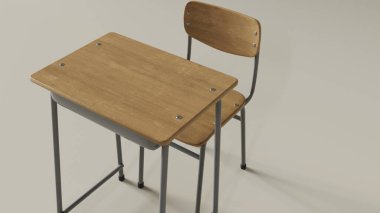 Basit bir arkaplanın önünde tek başına bir okul masası var.